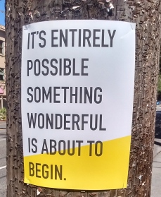 Sign says "it's entirely possible something wonderful is about to begin."